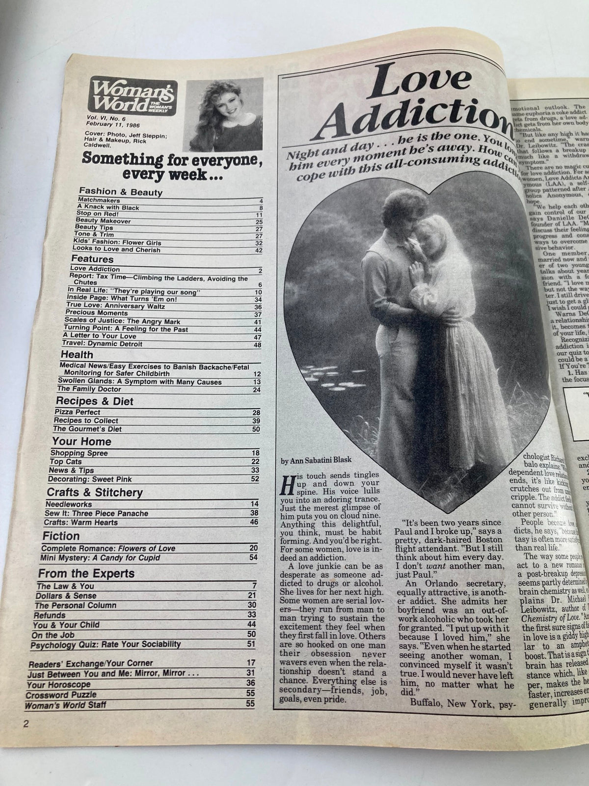Woman's World Magazine February 11, 1986, featuring an article titled 'Love Addiction' along with the contents and sections on Fashion & Beauty, Health, Recipes, and more. The image displays the magazine's cover and pages with detailed text and images related to relationships and wellness.