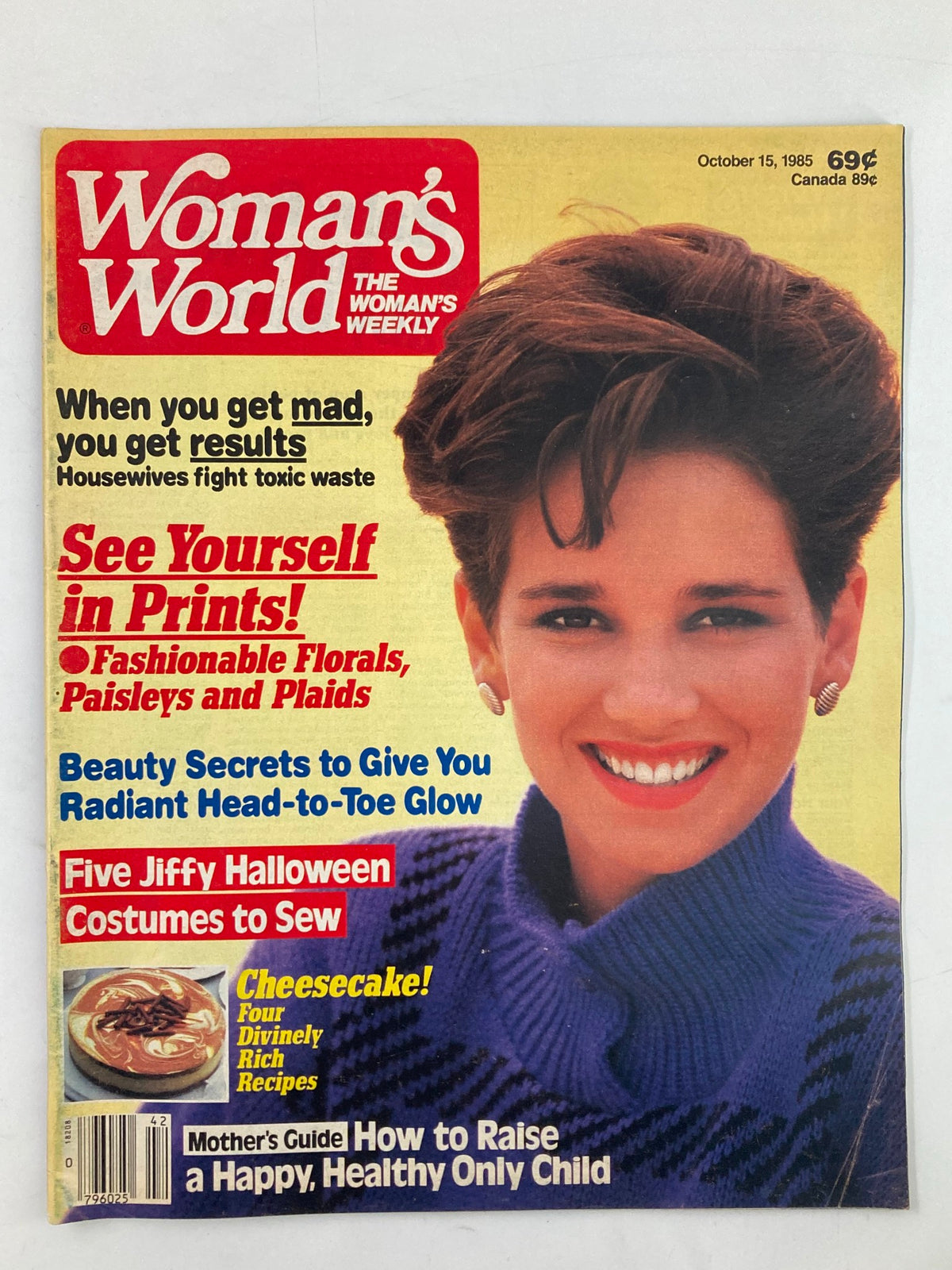 Cover of Woman's World Magazine October 15, 1985 featuring the title 'Baby Boom for the Baby Boomers' with a smiling woman in a blue sweater. Includes teasers for articles on fashion, beauty, Halloween costumes, and a cheesecake recipe.