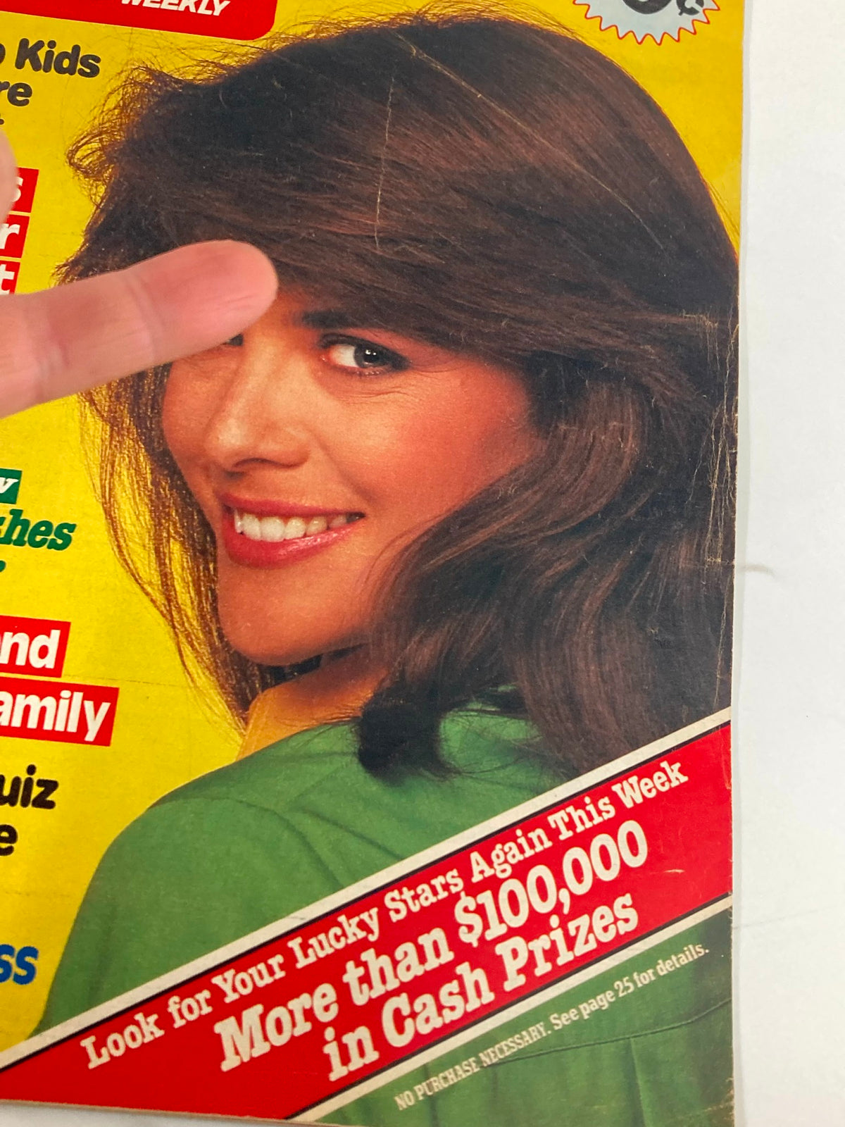 Close-up of the cover of Woman's World Magazine, October 9, 1984, emphasizing the title and a prize contest, with a smiling woman in a green outfit.