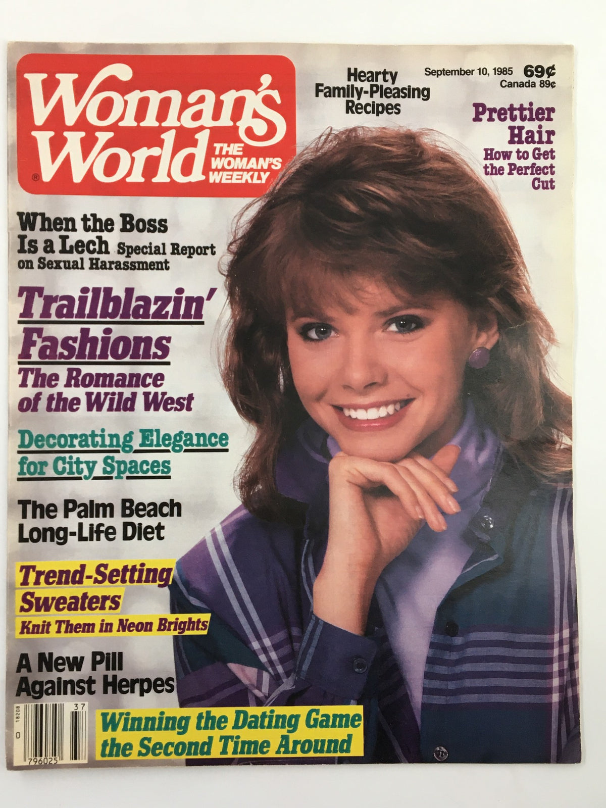 Cover of Woman's World Magazine from September 10, 1985, featuring the title 'When The Boss Is a Lech'. The magazine showcases articles on fashion, recipes, and lifestyle tips, with a smiling woman on the cover wearing a stylish purple and plaid outfit. The issue discusses topics like sexual harassment, diet tips, and sweater styles, making it a vintage source of 1980s women's interests.