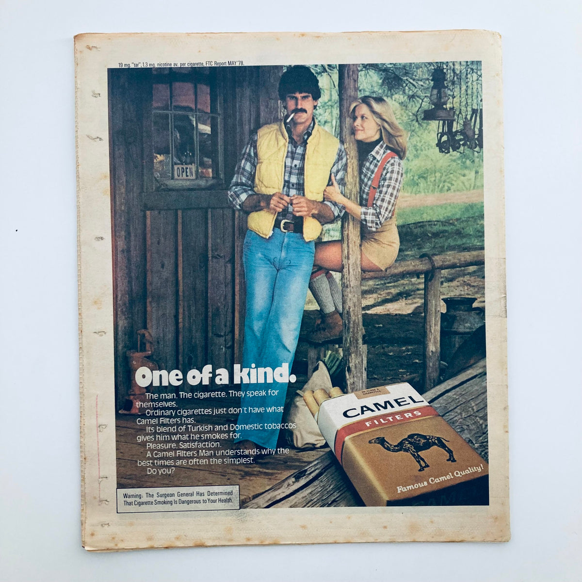 Advertisement page from the VTG Rolling Stone Magazine August 10 1978, featuring a Camel Filters cigarette ad with models in outdoor attire, highlighting the tagline 'One of a kind'.