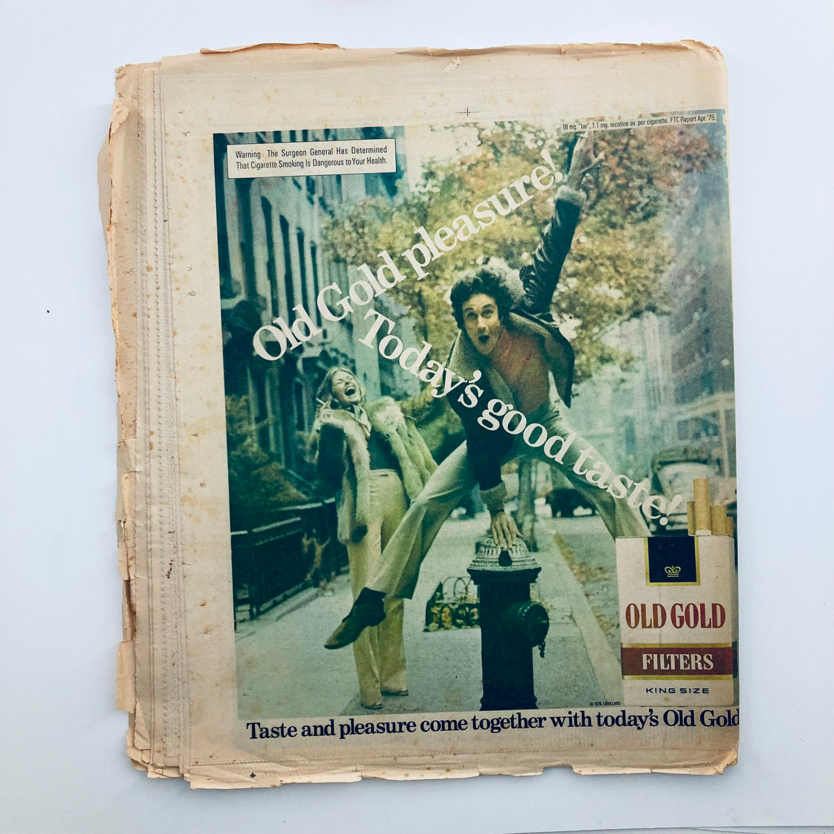 Cover image of the VTG Rolling Stone Magazine November 20, 1975, Issue No. 200 featuring a vintage advertisement for Old Gold cigarettes with a dynamic scene of a man jumping joyfully on a street, emphasizing the magazine's significance in 1970s music and culture history.
