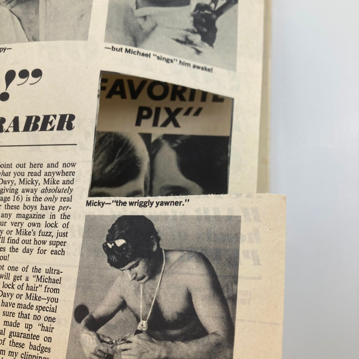Image from VTG 16 Magazine December 1967 showcasing a vintage photograph of a young man wearing a necklace and working with a tool, highlighting 1960s fashion trends.