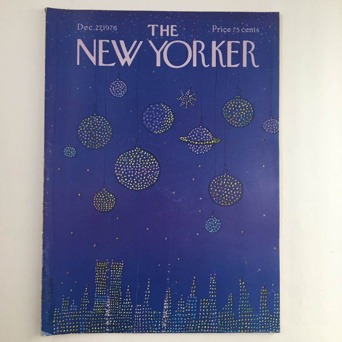 Cover of The New Yorker Magazine December 27 1976, featuring a blue background with colorful decorative ornaments and stars, designed by Eugene Mihaesco.