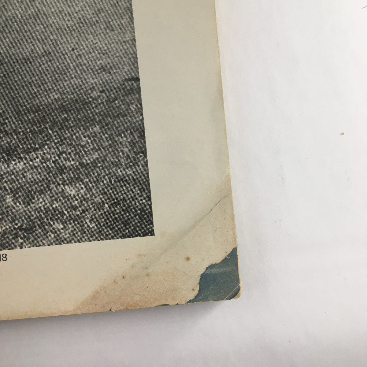 Image of the bottom edge of The New Yorker Magazine January 26 1976 showing the creased spine and signs of age, adding character to this vintage artwork.