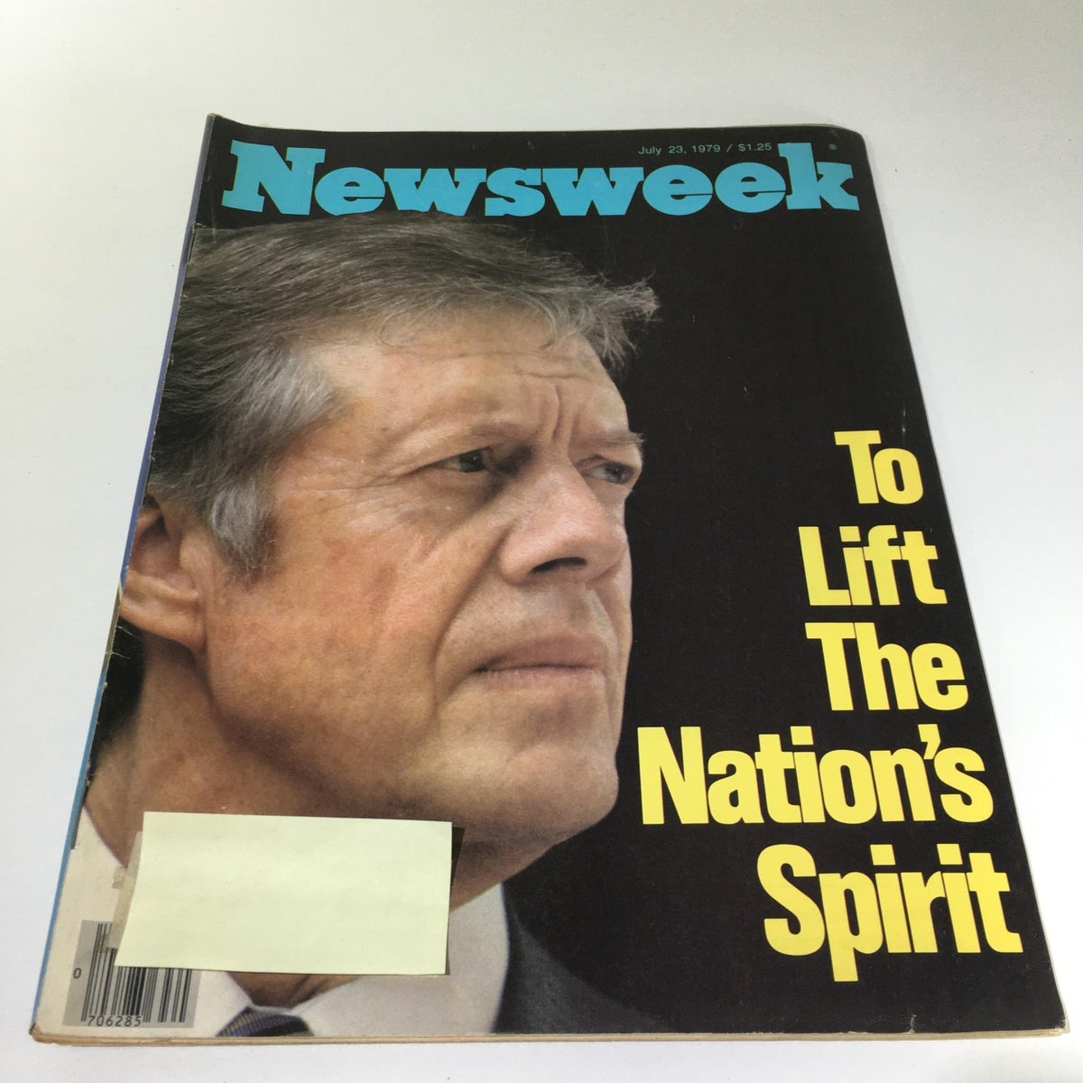 Cover of Newsweek Magazine: July 23, 1979 - To Lift The Nation's Spirit featuring a close-up image of a solemn expression with a yellow headline. This vintage magazine captures a pivotal moment in American history.