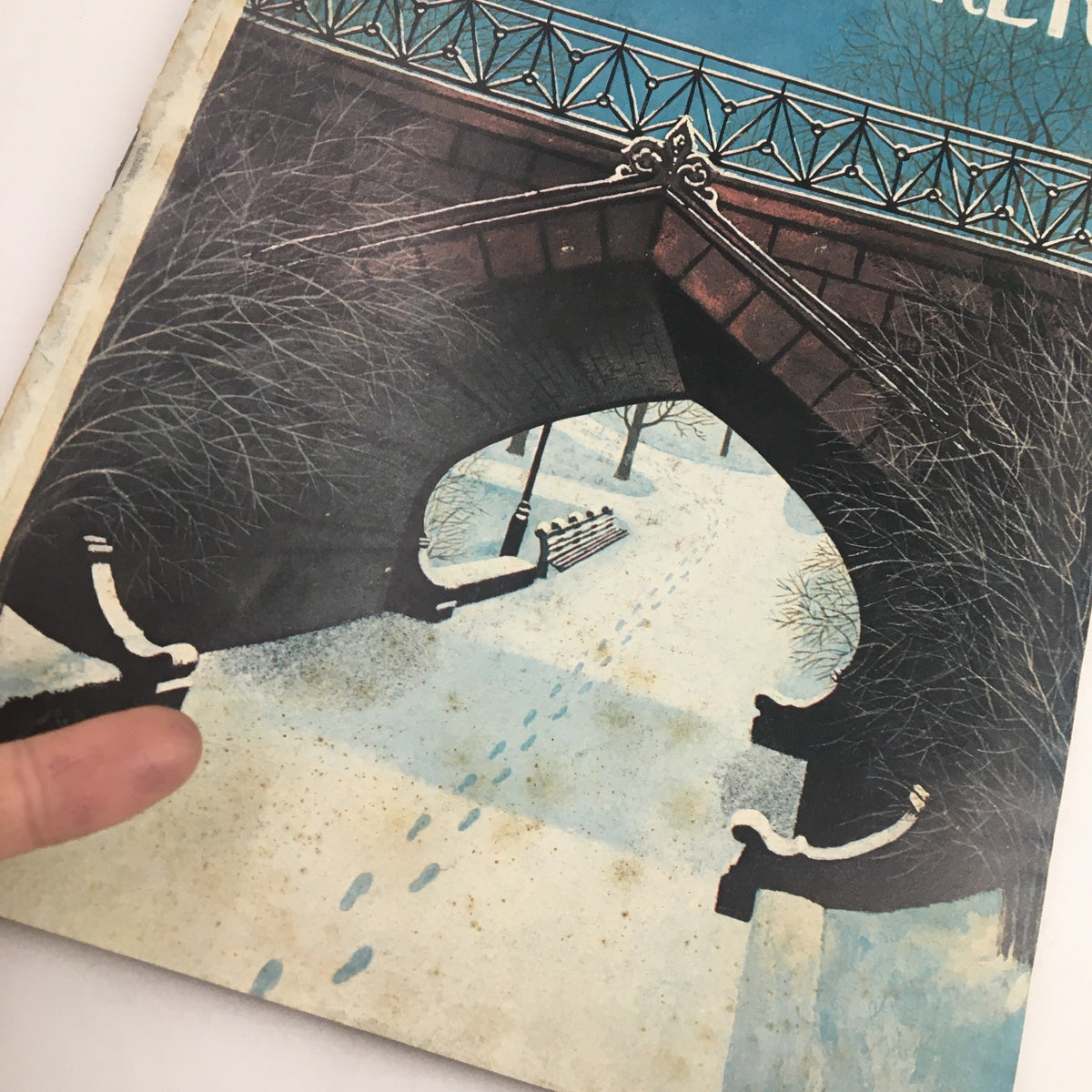 Close-up view of The New Yorker Magazine January 7 1974 cover, highlighting the illustration 'Footprints in the Snow' by Charles E. Martin, showing a snowy scene with footprints.
