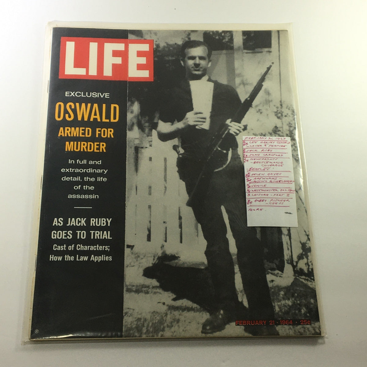 Front cover of the VTG Life Magazine from February 21, 1964, displaying Lee Harvey Oswald holding a firearm, along with various headlines including 'AS JACK RUBY GOES TO TRIAL'.
