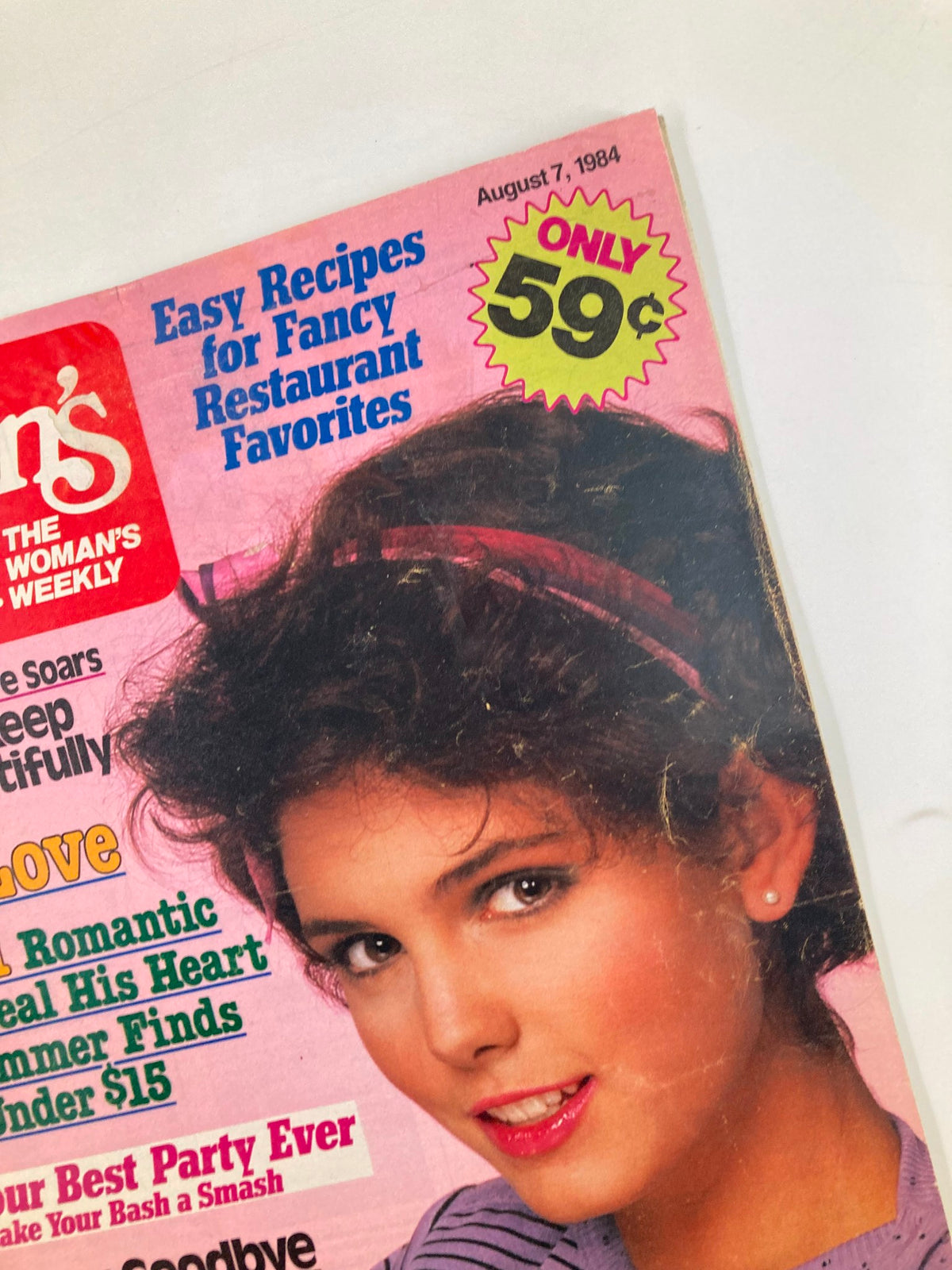 Close-up of the Woman's World Magazine August 7 1984 cover showing the title and promotional highlights with a price tag of 59 cents.