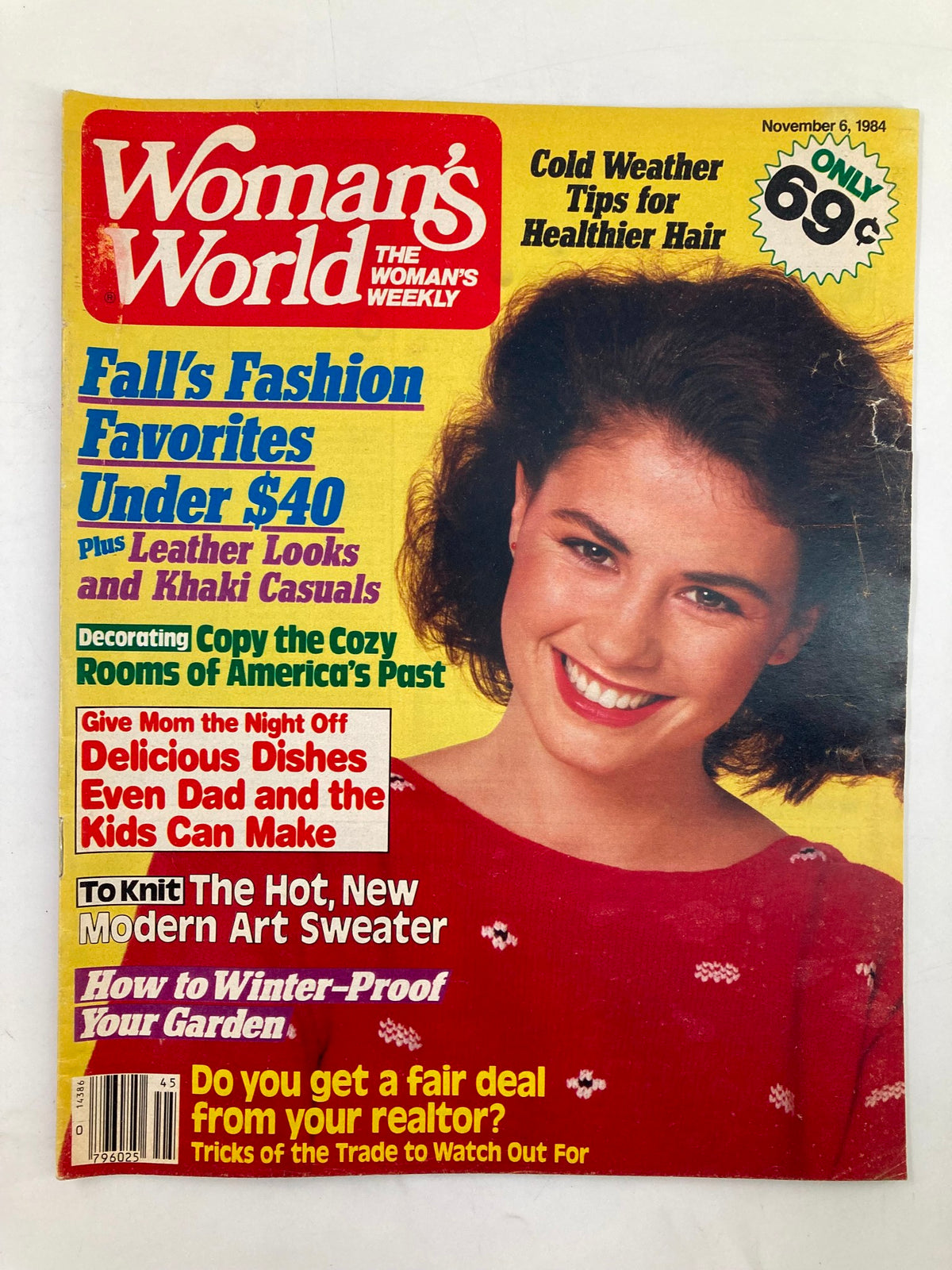 Cover of Woman's World Magazine dated November 6, 1984, featuring the title 'How to Winter-Proof Your Garden.' The magazine showcases colorful sections on fall fashion favorites, hair care tips, and modern art sweater knitting, with an image of a smiling woman wearing a festive red sweater.