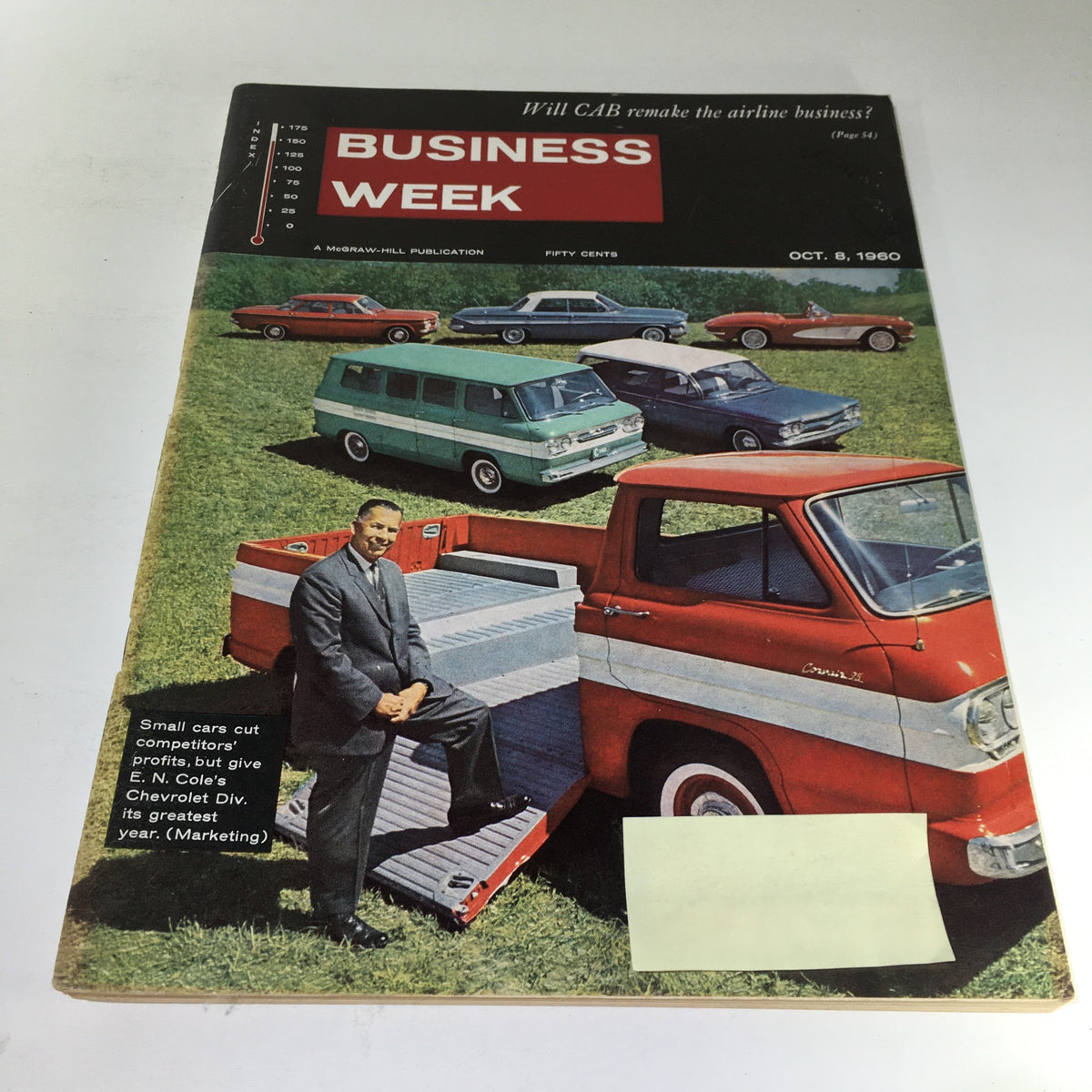 Cover of Business Week Magazine from October 8, 1960, featuring a man posing with a red Chevrolet truck amidst a backdrop of various small cars, highlighting the magazine's theme on how small cars cut competitors' profits.