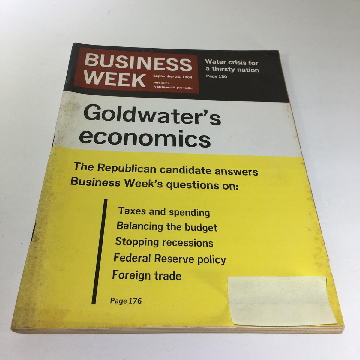Cover of Business Week Magazine from September 26, 1964 featuring the title 'Goldwater's Economics'. The magazine discusses economic issues addressed by the Republican candidate, highlighting topics like taxes, budget balancing, and foreign trade. Visible wear indicates its vintage nature.