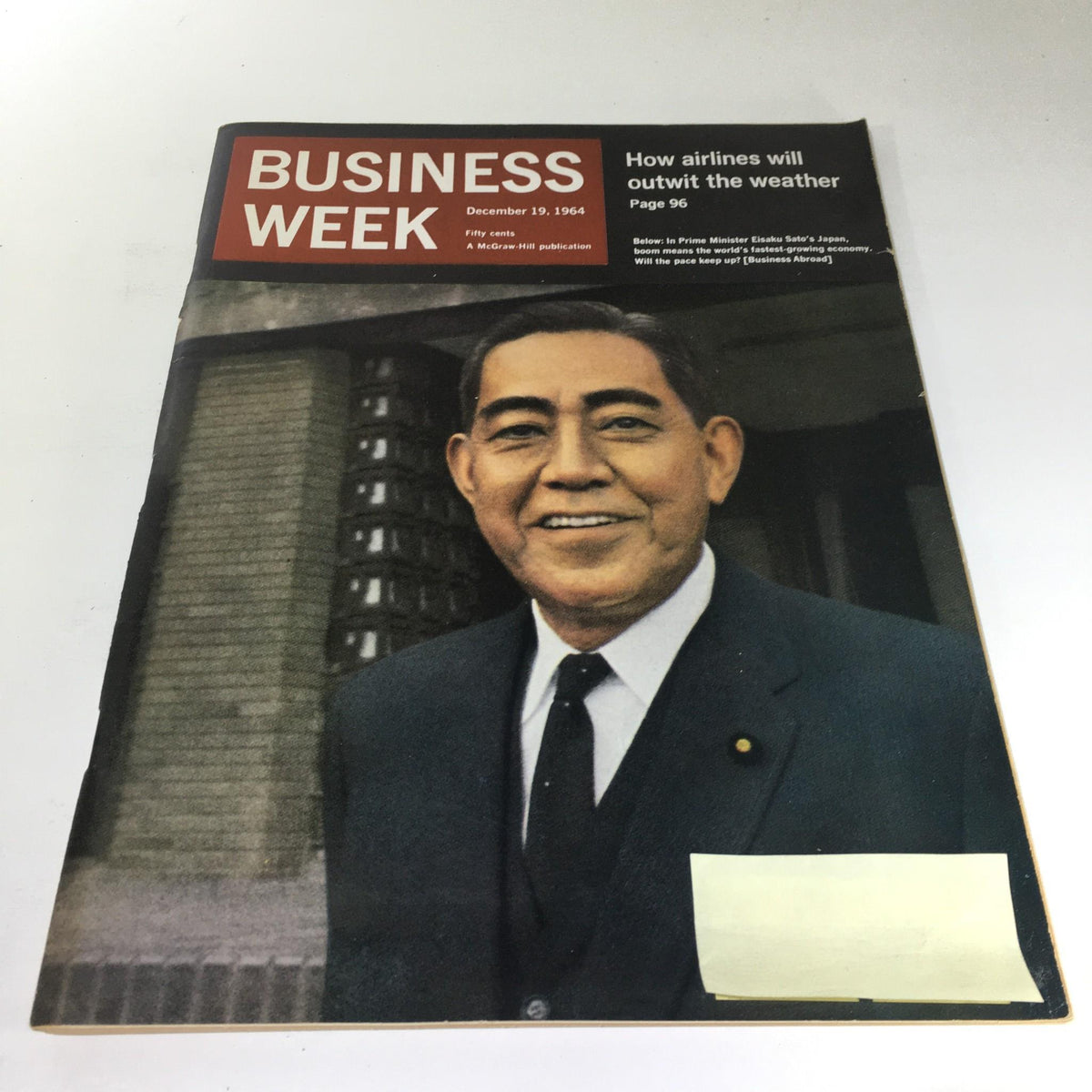 Cover of Business Week Magazine from December 19, 1964, featuring Japan's Prime Minister Eisaku Sato, highlighting a vintage focus on historical political events in Japan.