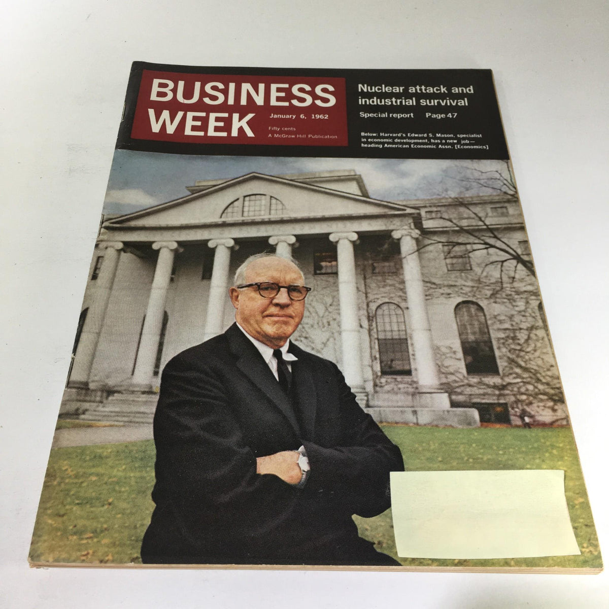 Cover of Business Week Magazine from January 6, 1962 featuring Harvard's Edward S. Mason, a prominent figure in economic development, standing in front of an iconic building.
