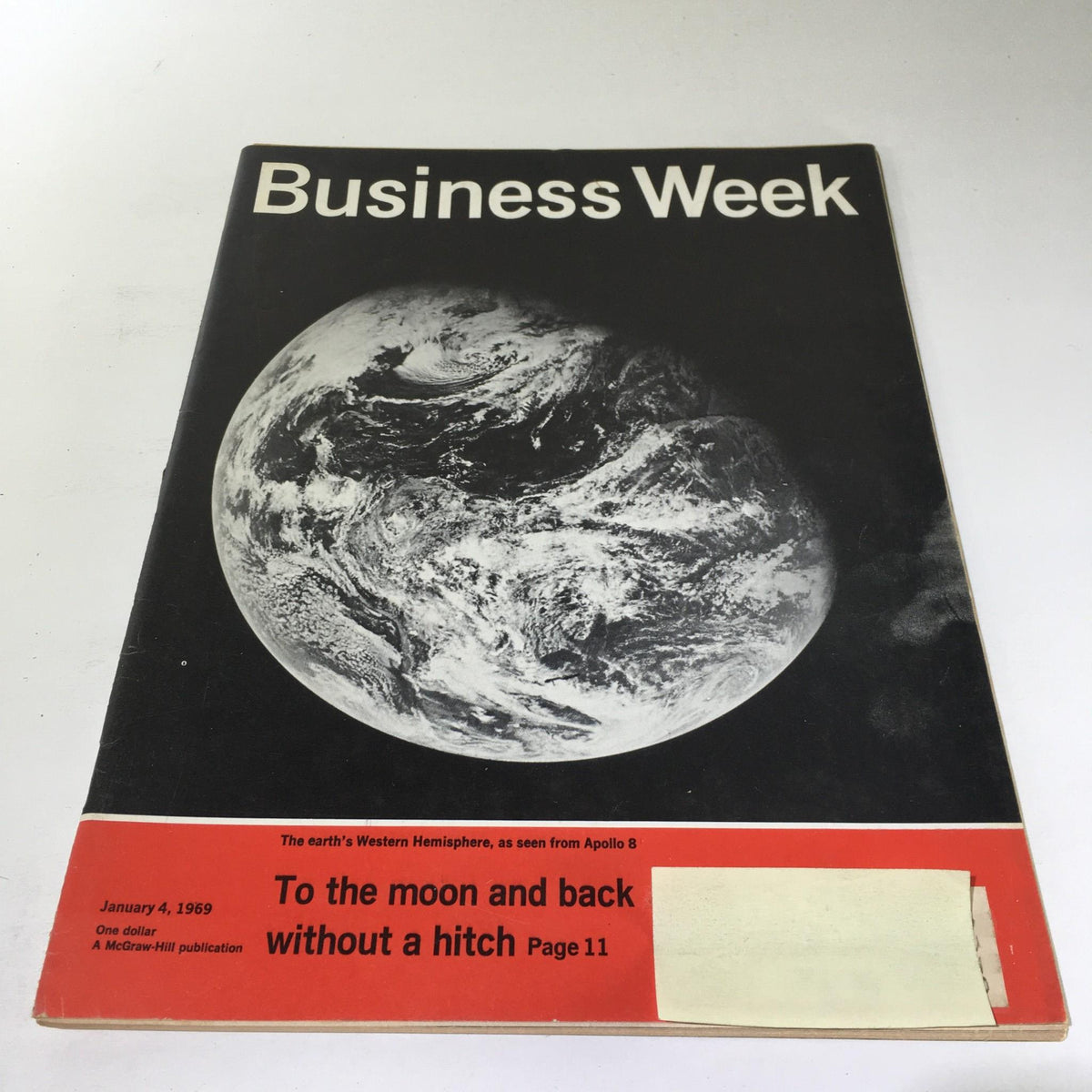 Business Week Magazine cover from January 4, 1969 featuring a view of Earth as seen from Apollo 8, with the headline 'To The Moon And Back Without A Hitch'. This vintage publication highlights the space race era.