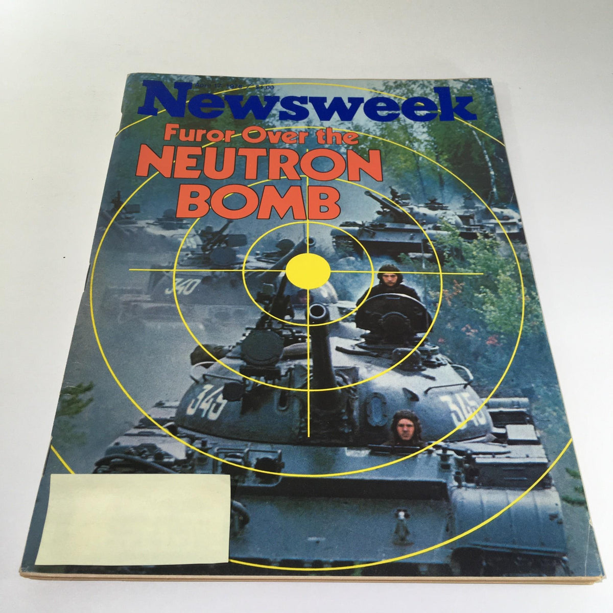 Cover of Newsweek Magazine from April 17, 1978, featuring the title 'Furor Over the Neutron Bomb' along with an image of military tanks, highlighting themes of global politics and military strategy.