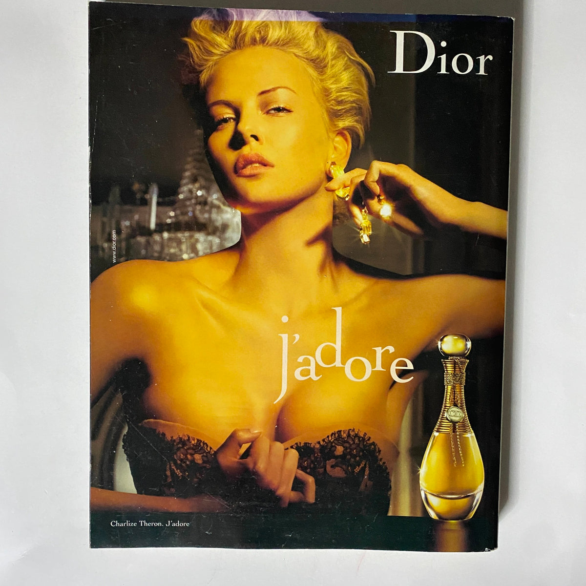 Dior Jadore advertisement featuring a glamorous model Charlotte Theron, showcasing the beauty product along with the prominent branding, associated with the high fashion theme of Vogue UK Magazine September 2007.