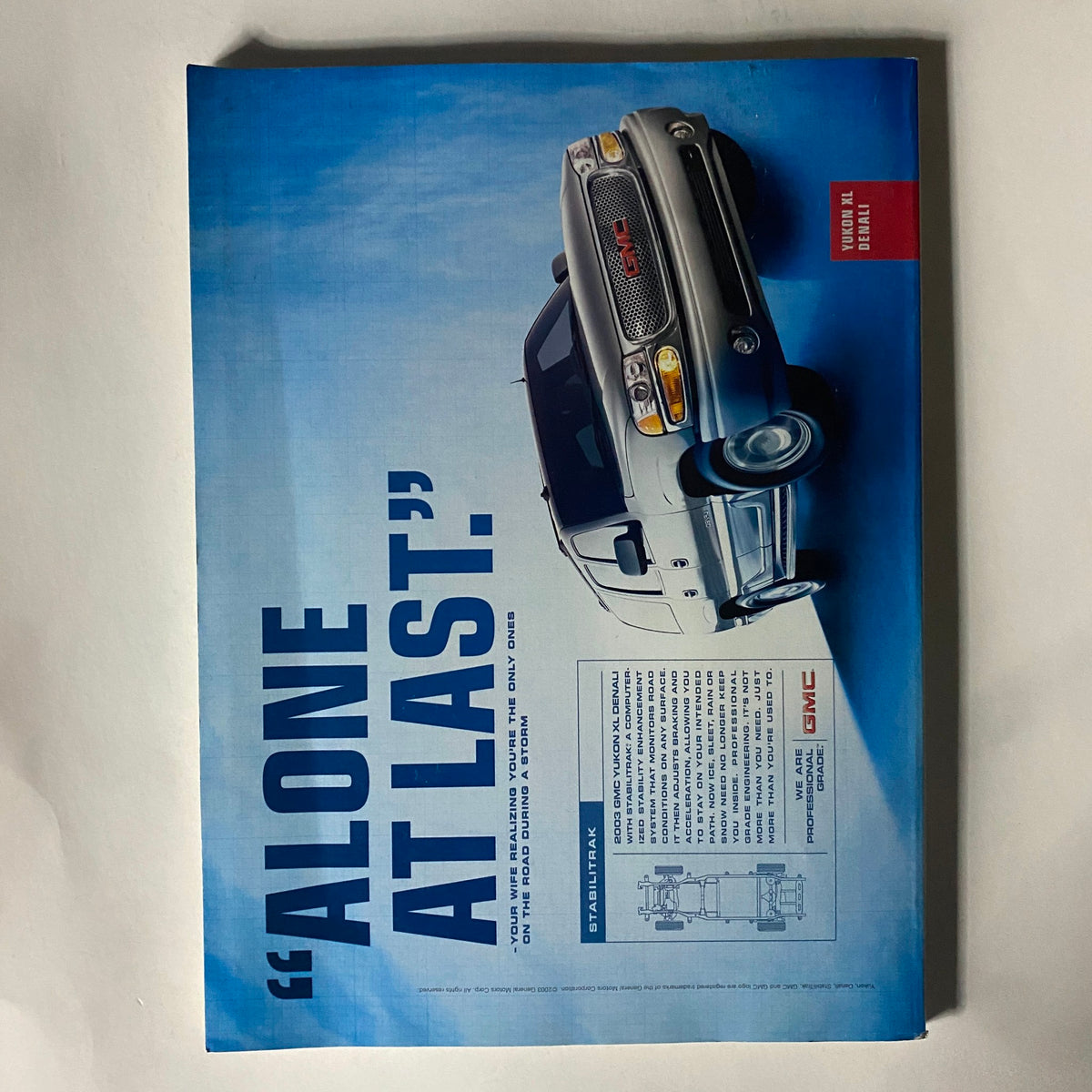 Back cover of Fortune Magazine - October 27, 2003, showcasing a GMC vehicle advertisement with the tagline 'Alone at Last'.