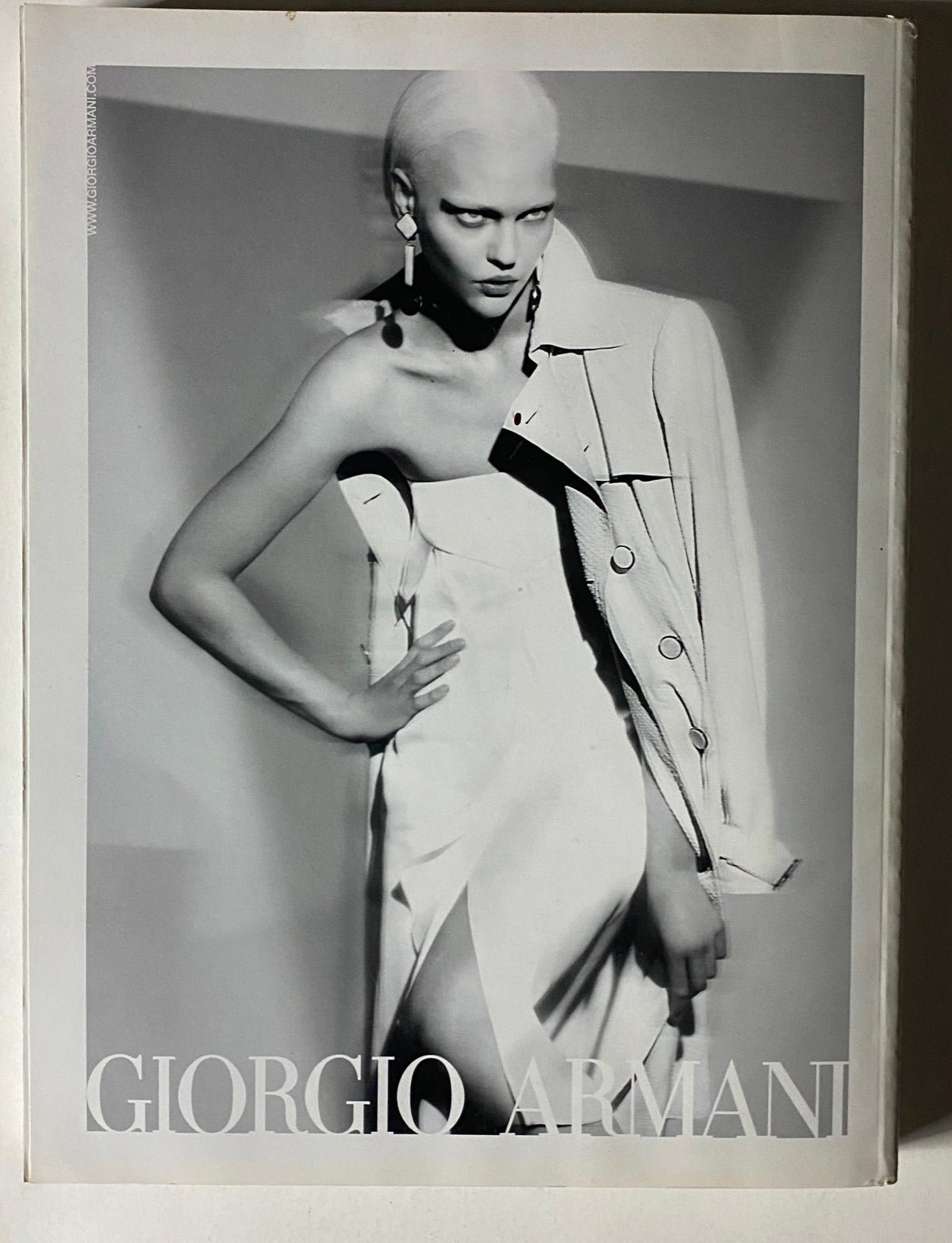 Cover image from Vogue Magazine 2009 featuring Spring's Fearless Fashions, showcasing a model in a striking Giorgio Armani outfit, embodying high-fashion editorial style.