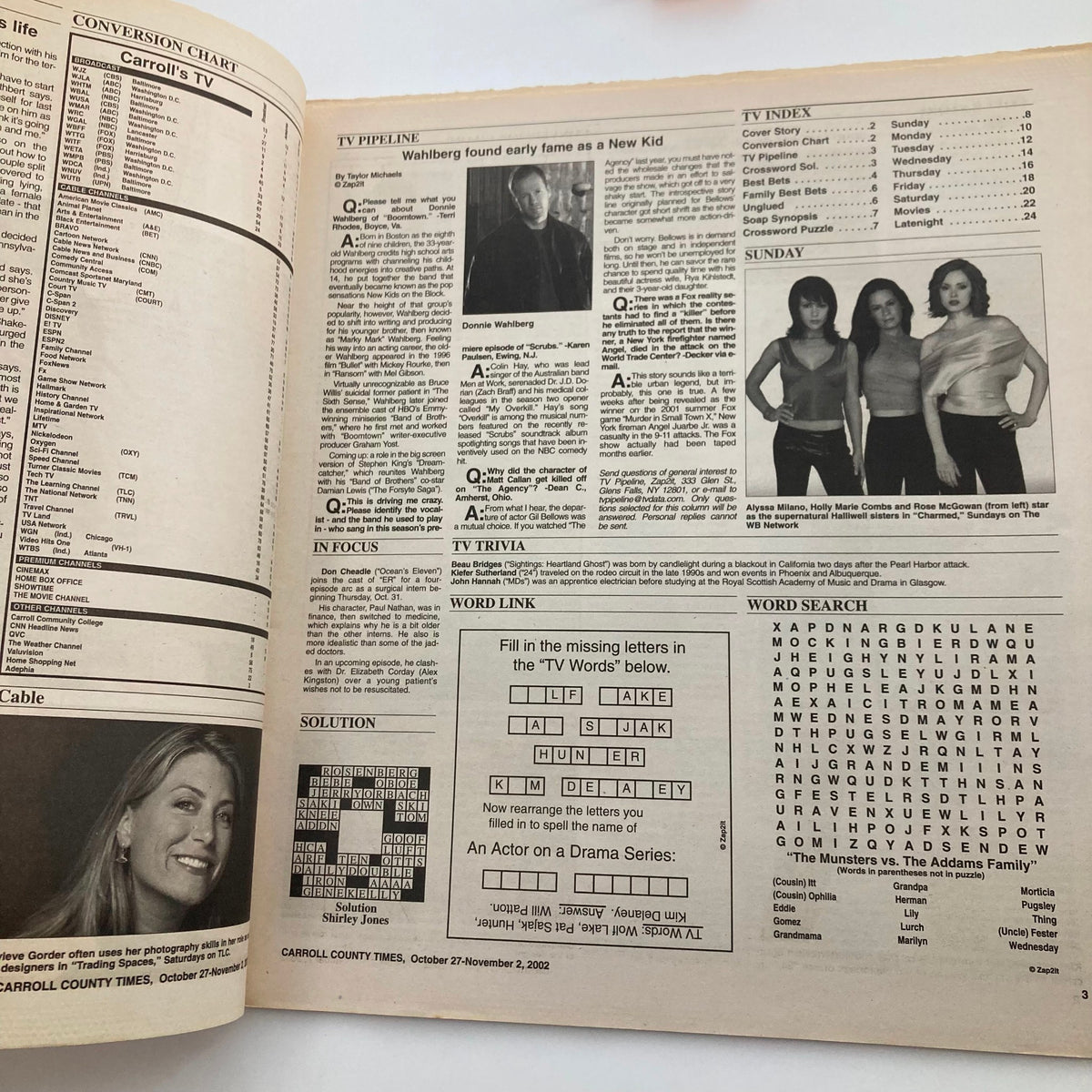 Inside spread of TV Week Magazine October 27 2002, showcasing TV listings and trivia, with a focus on shows from that era.