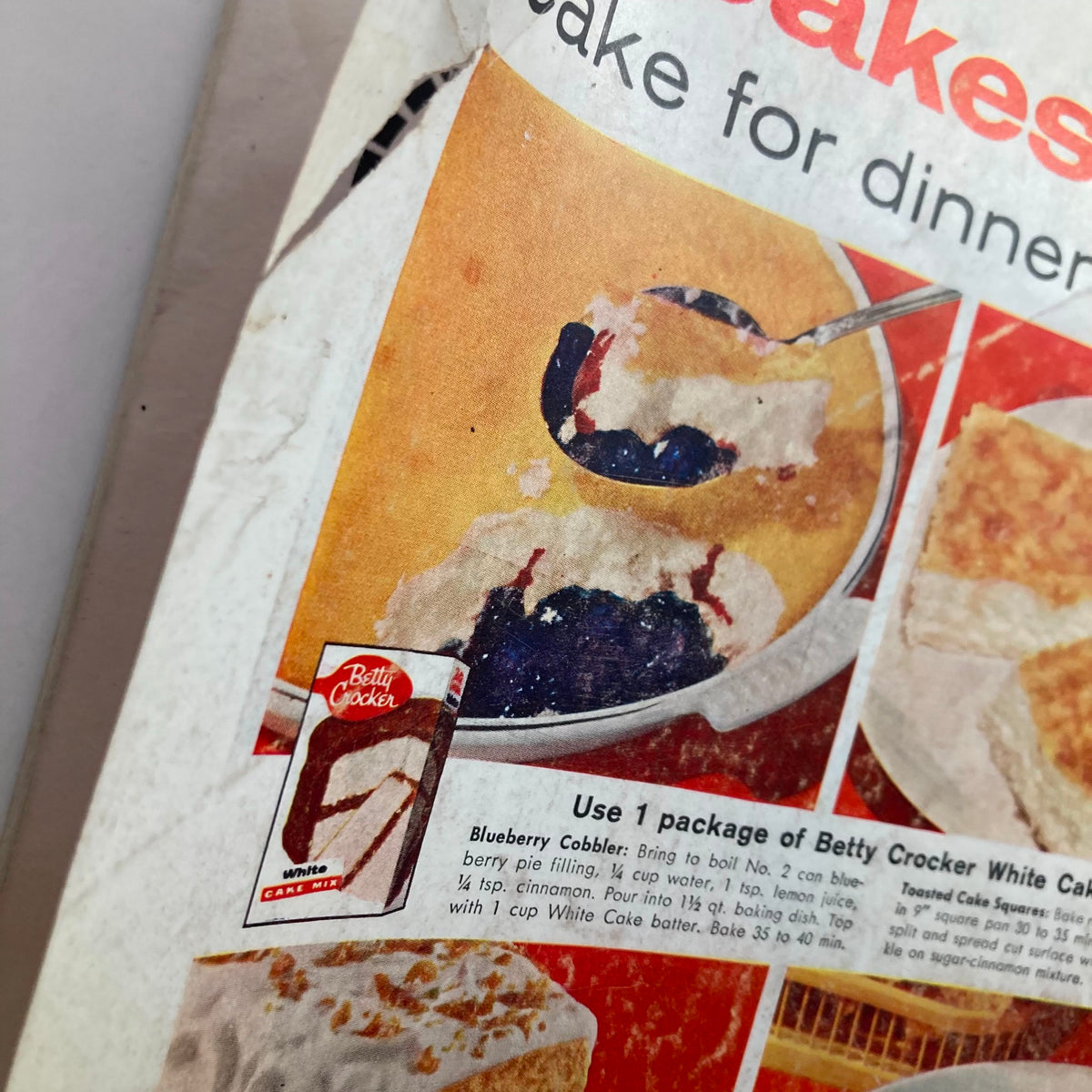 Close-up of Betty Crocker White Cake Mix advertisement with a recipe for Blueberry Cobbler shown in a bowl. From The Saturday Evening Post September 20 1958.