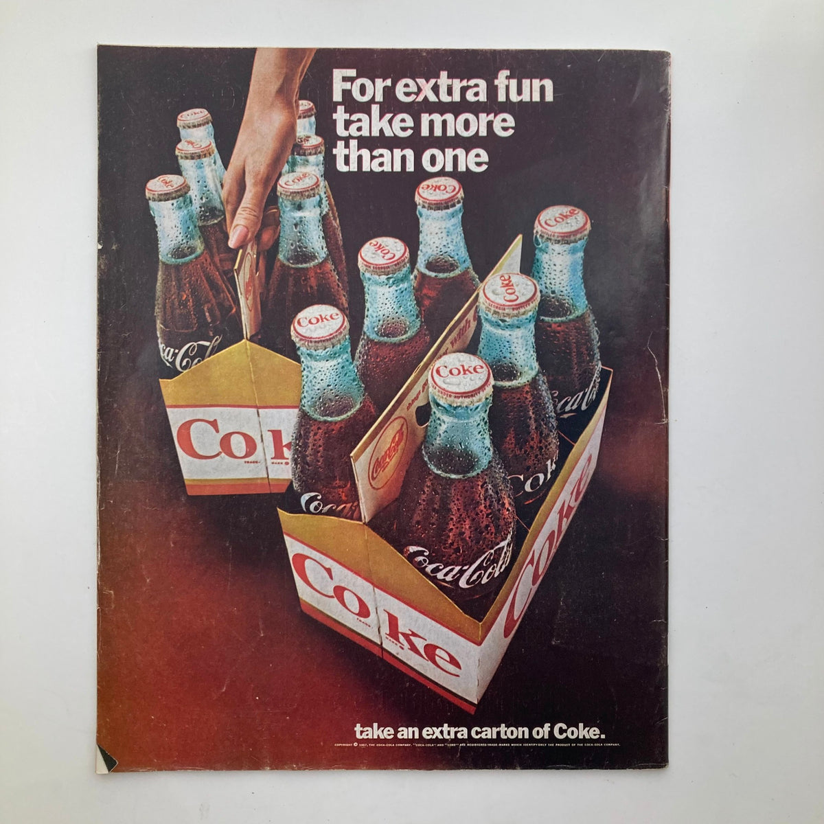 Back cover of The Saturday Evening Post June 17 1967 issue featuring an advertisement for Coca-Cola, promoting multiple bottles for extra fun.