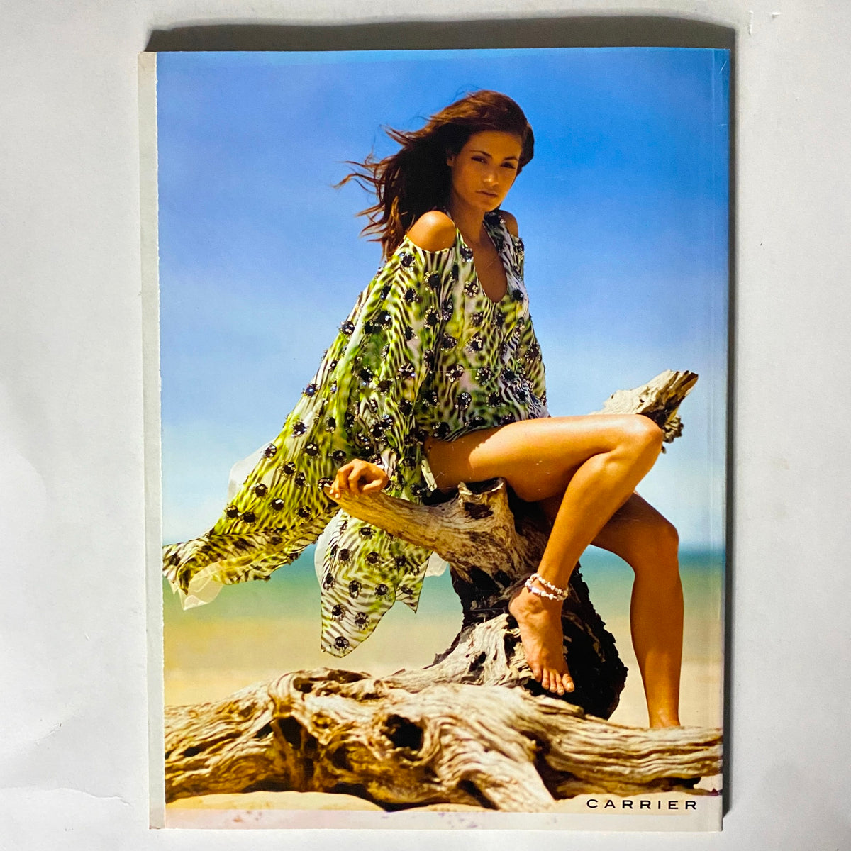 Back cover of Harper's Bazaar Magazine 2008 Travel Guide featuring a model in a vibrant beach outfit, emphasizing lifestyle and fashion connected to travel.