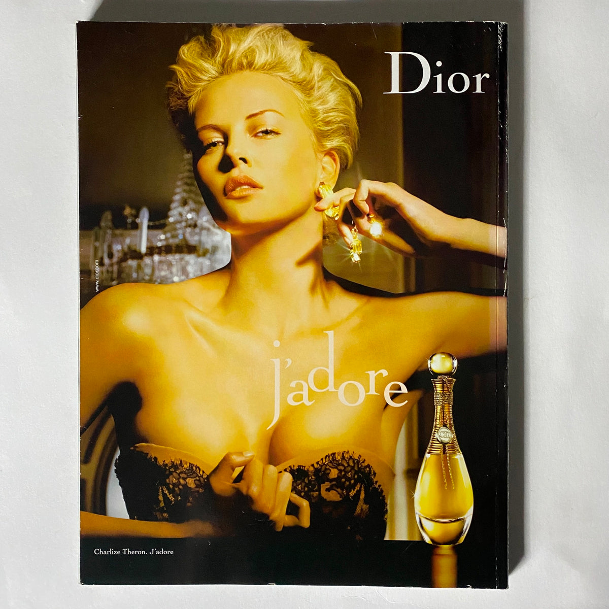 Promotional image for Dior J'adore featuring a glamorous model, highlighting luxury fragrance and beauty aesthetics.
