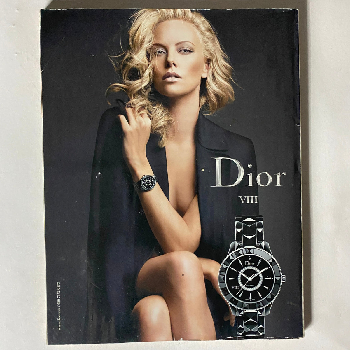 Elle UK Magazine July 2011 advertisement for Dior VIII, featuring a stunning model with luxurious jewelry, representing contemporary fashion aesthetics.