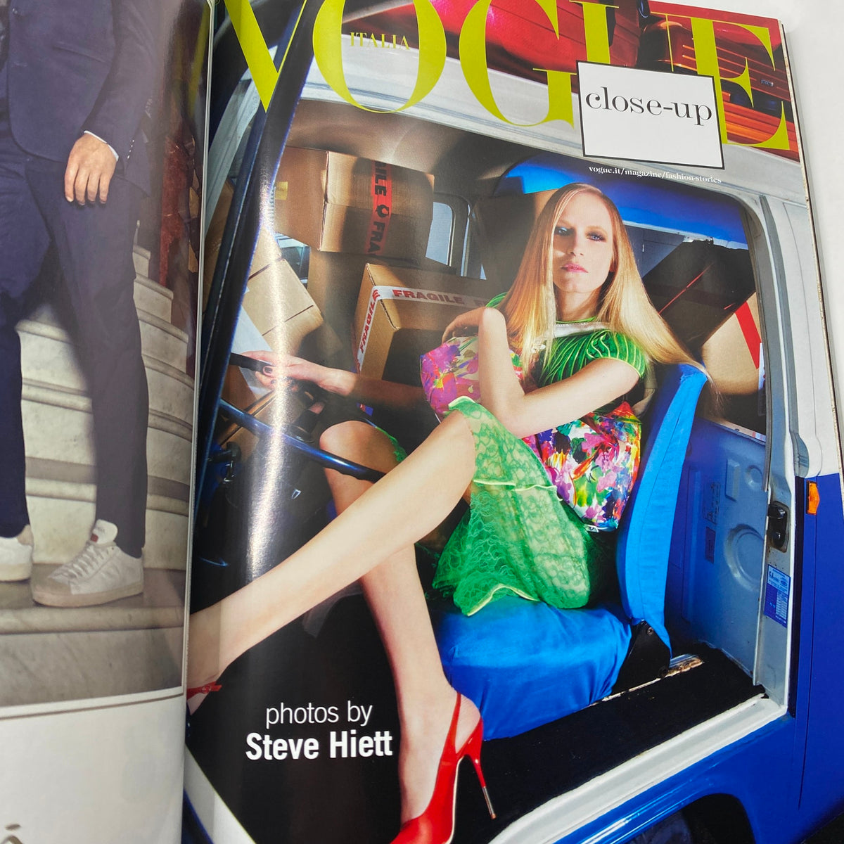 Close-up editorial image from Vogue Italia Magazine April 2011, featuring a model styled in vibrant fashion photographed by Steve Hiett.