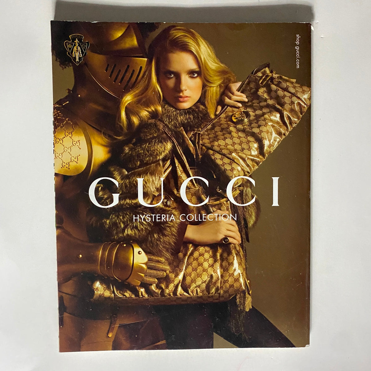 Cover of Vogue UK Magazine August 2008 featuring model Lily Donaldson alongside a stylized Gucci advertisement, highlighting the Hysteria Collection and vintage fashion themes.