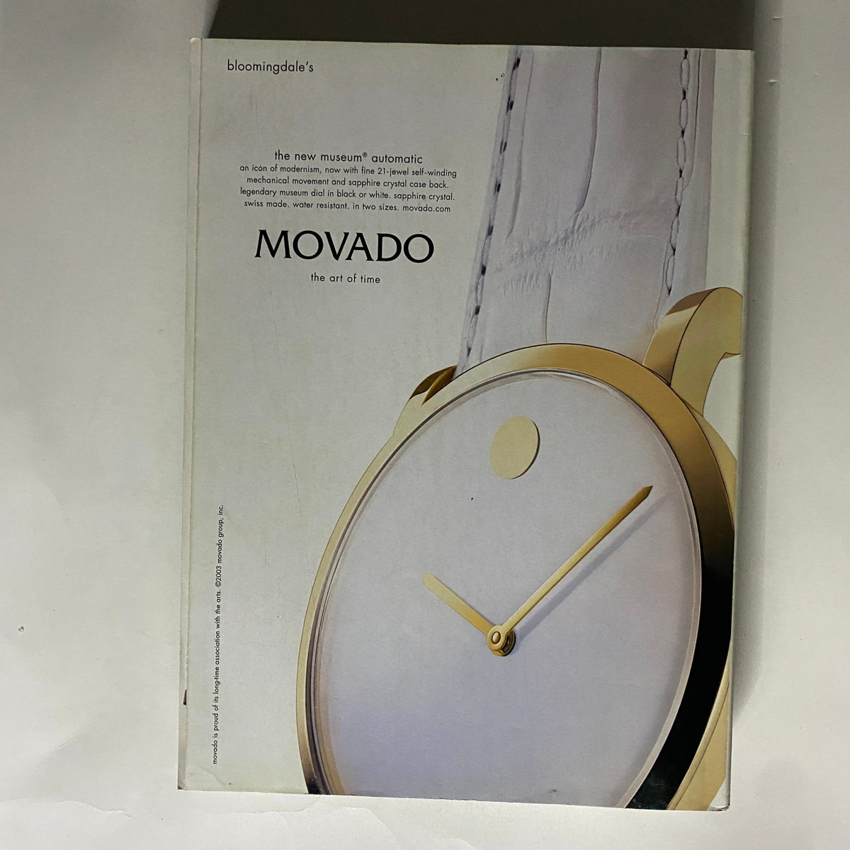 Advertisement for Movado watches from Vogue Magazine September 2003, emphasizing the modern design and craftsmanship of the timepiece.