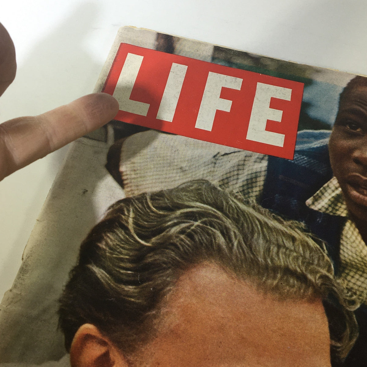 Close-up of the cover of Life Magazine dated March 21, 1960, highlighting the title 'LIFE' and the feature on Billy Graham in Africa.