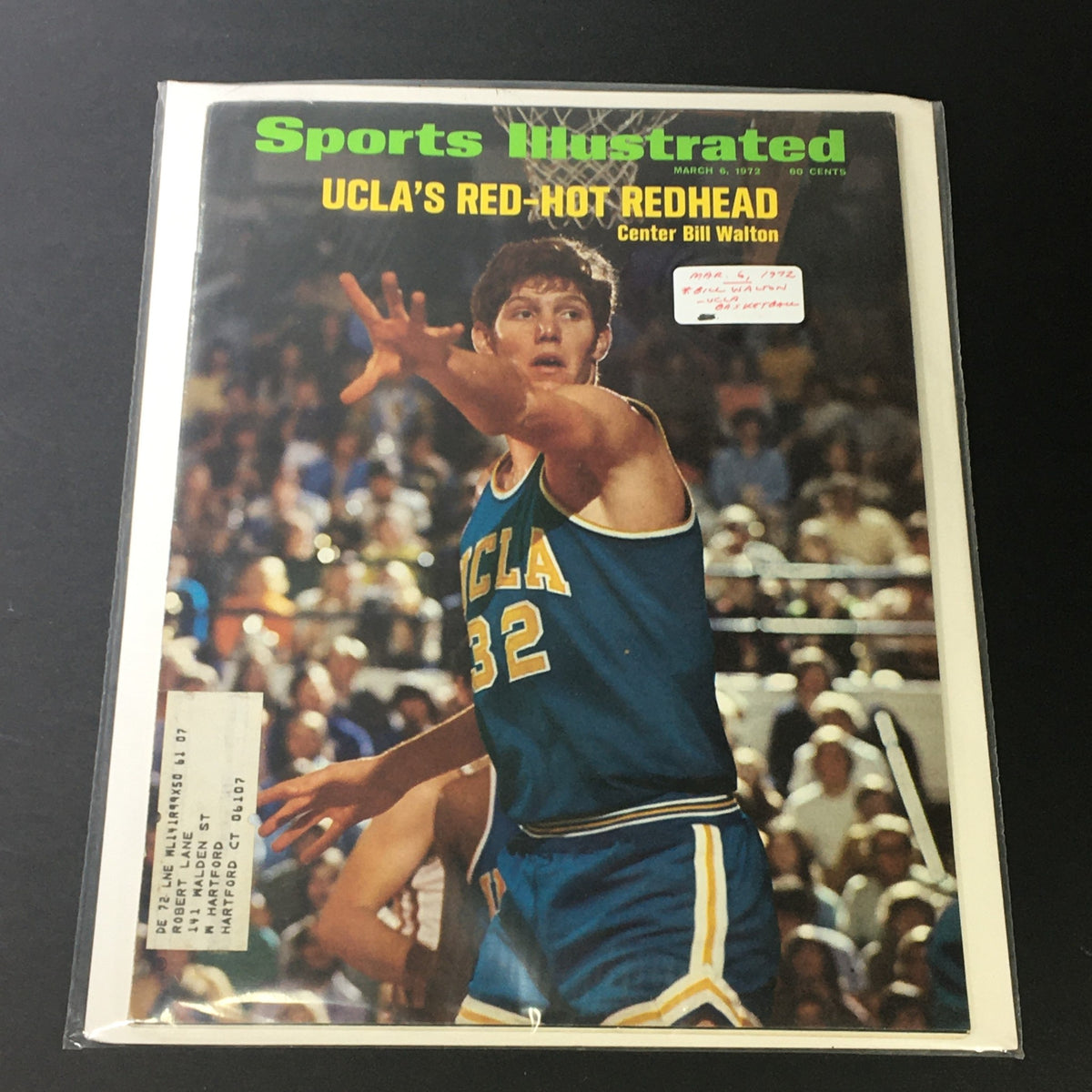Sports Illustrated Magazine dated March 6, 1972 with Bill Walton as UCLA's Center on the cover, encapsulated in protective plastic, displaying his iconic basketball moment.