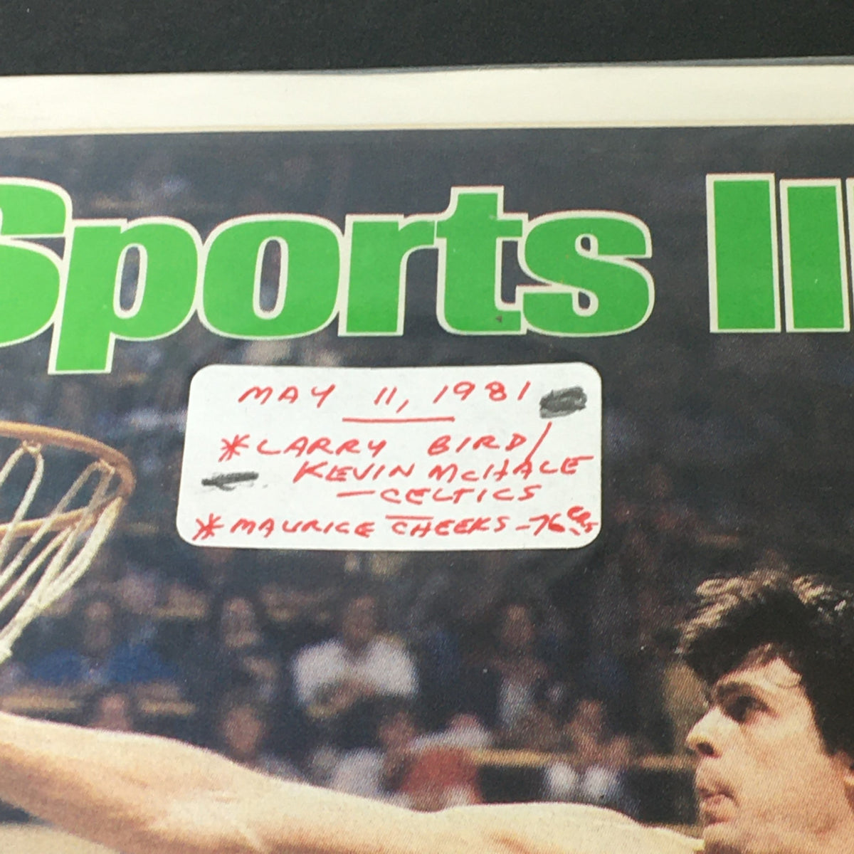 Close-up of the cover of Sports Illustrated Magazine May 11 1981, noting Larry Bird, Kevin McHale, and Maurice Cheeks, emphasizing the historical significance of the featured basketball game.