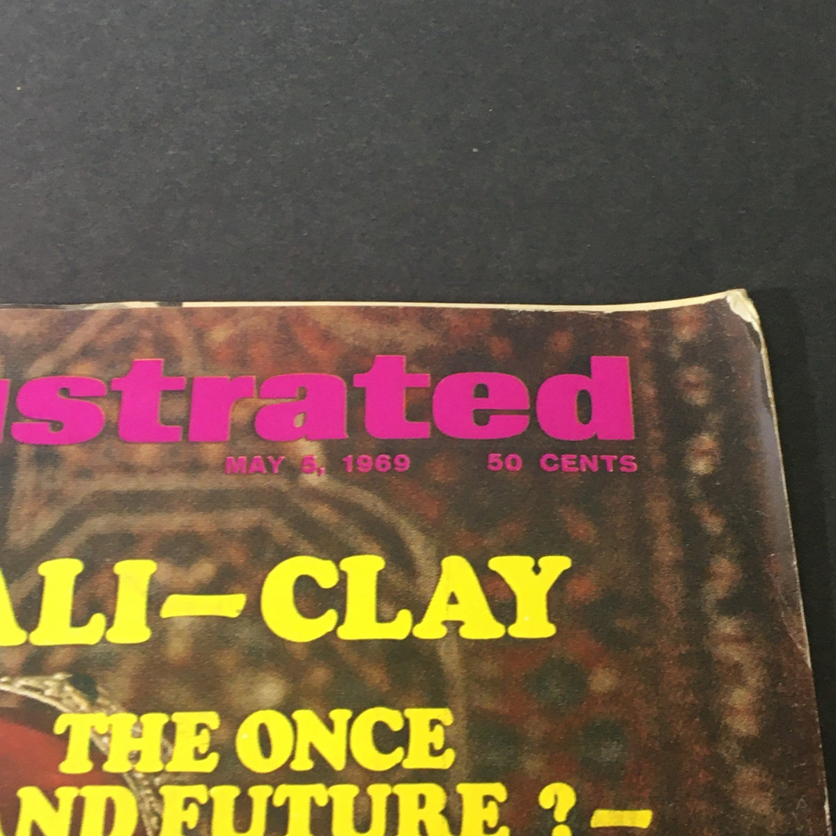 Close-up of the Sports Illustrated Magazine May 5 1969 title, displaying the iconic words 'ALI-CLAY THE ONCE AND FUTURE ? - KING'.