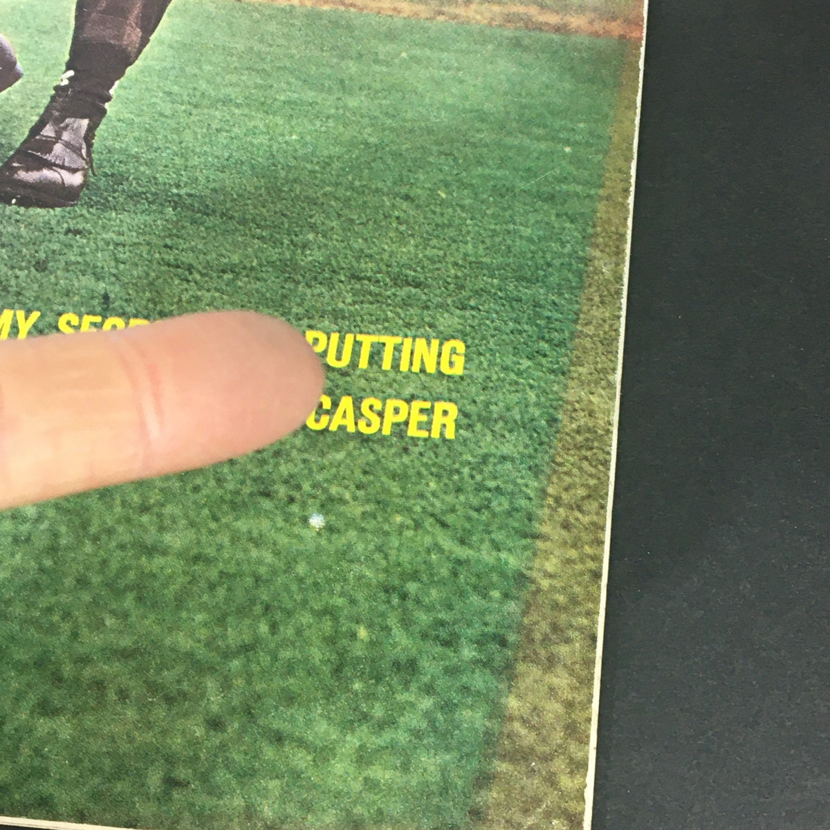 Close-up of VTG Sports Illustrated Magazine February 20 1961 cover, highlighting the title 'My Secrets of Putting by Bill Casper' with a finger pointing at the text.