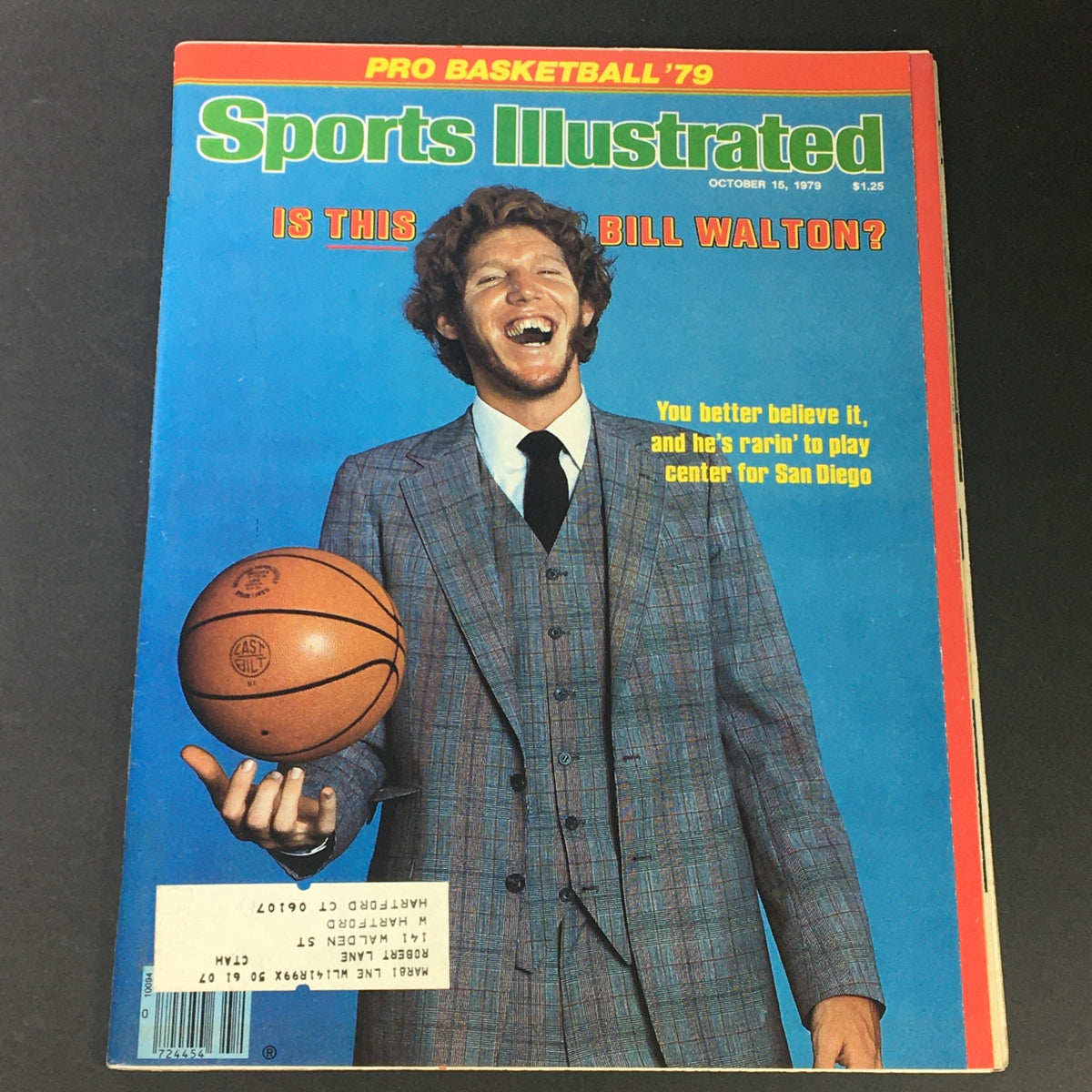 Vintage Sports Illustrated magazine cover from October 15, 1979, featuring Bill Walton with a basketball, wearing a stylish suit, and showcasing a vibrant late 1970s design. This issue also highlights Larry Bird, making it a collectible item for sports history enthusiasts.
