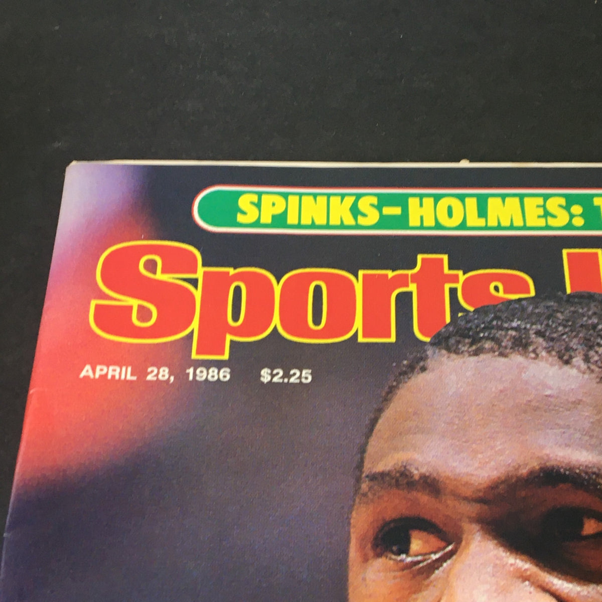 Close-up of Sports Illustrated magazine cover dated April 28, 1986, featuring Dominique Wilkins, showcasing magazine title and publication date.