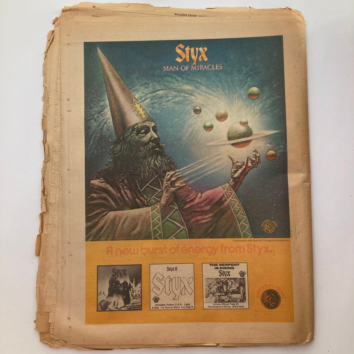Vintage Rolling Stone Magazine December 5, 1974, No. 175 featuring an advertisement for the band Styx titled 'Man of Miracles'. The artwork visually represents a mystical figure amidst planets, capturing the pop culture essence of the 1970s.