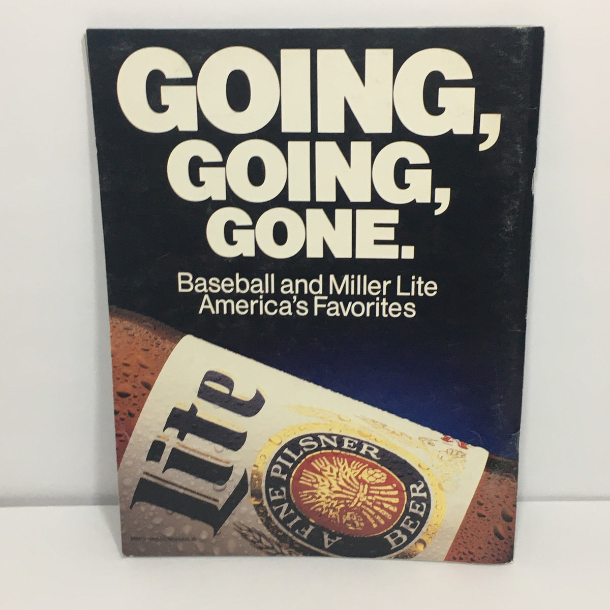 1989 MLB Official Team: Kansas City Royals Yearbook with a cover that includes the phrase 'GOING, GOING, GONE' alongside a Miller Lite advertisement, blending baseball culture with American favorites.