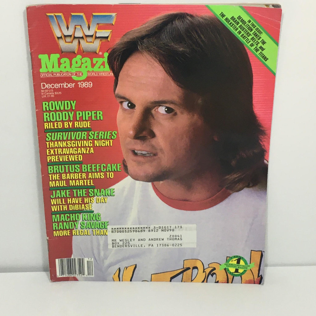 Cover of WWF / WWE Magazine December 1989 featuring Rowdy Roddy Piper, highlighting Survivor Series and other wrestling events, with vibrant red background and text detailing featured wrestlers.