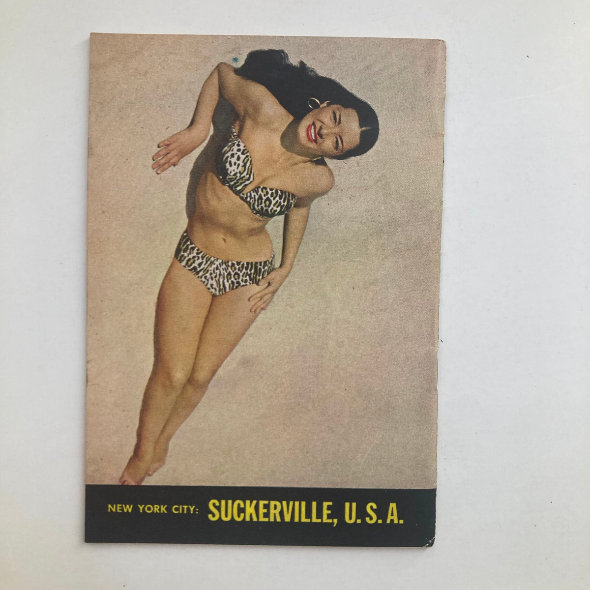 Promotional page in VTG Focus Magazine June 1952, featuring an illustration of a woman in a leopard print bikini, adding to the vintage allure.