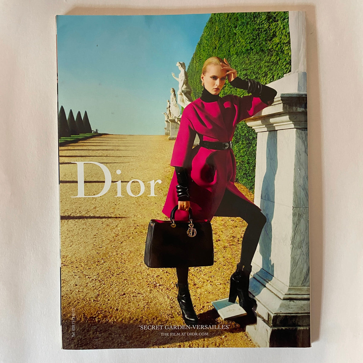 Advertisement page from Harper's Bazaar UK Magazine August 2012 for Dior, displaying a chic model in a stylish outfit.