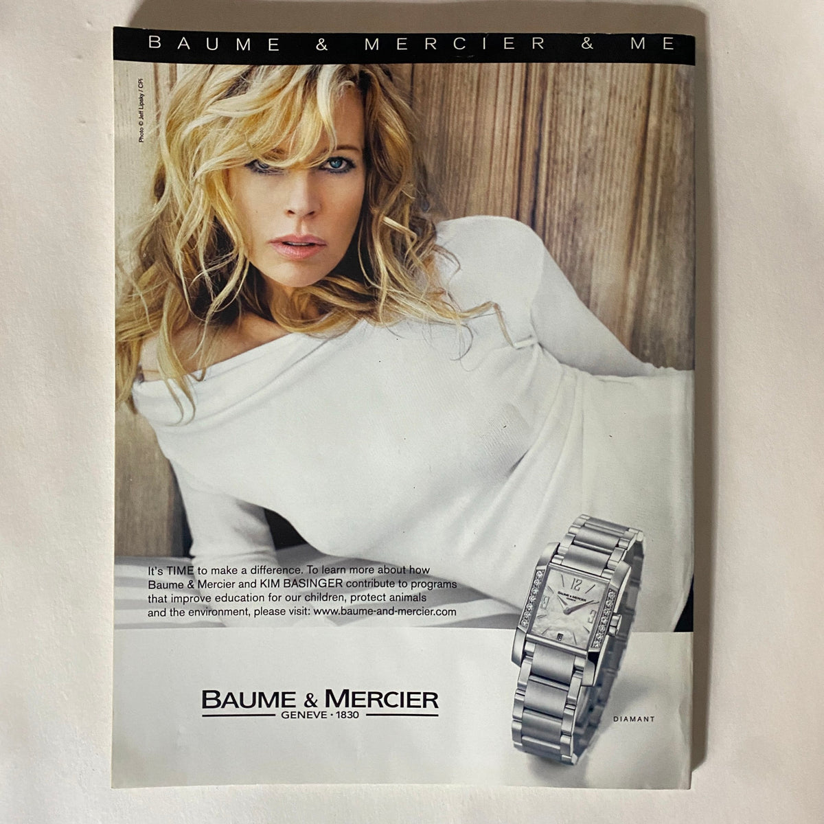 Advertisement from More Magazine December 2006 for Baume & Mercier watches, featuring a stylish model in a casual white top.