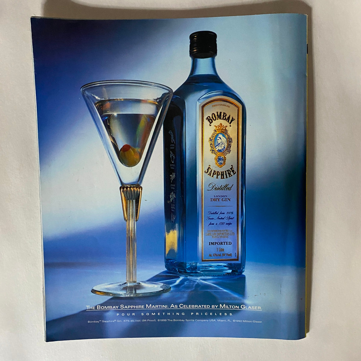 Artistic advertisement for Bombay Sapphire Gin in Gear Magazine December 1999, highlighting a martini and the iconic bottle, reflecting the vibrant culture of the late 90s.
