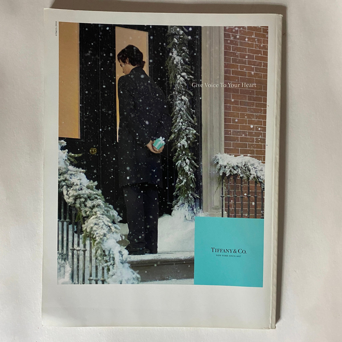 Advertisement page from Harper's Bazaar UK Magazine January 2010 for Tiffany & Co., featuring a stylish individual in winter attire.