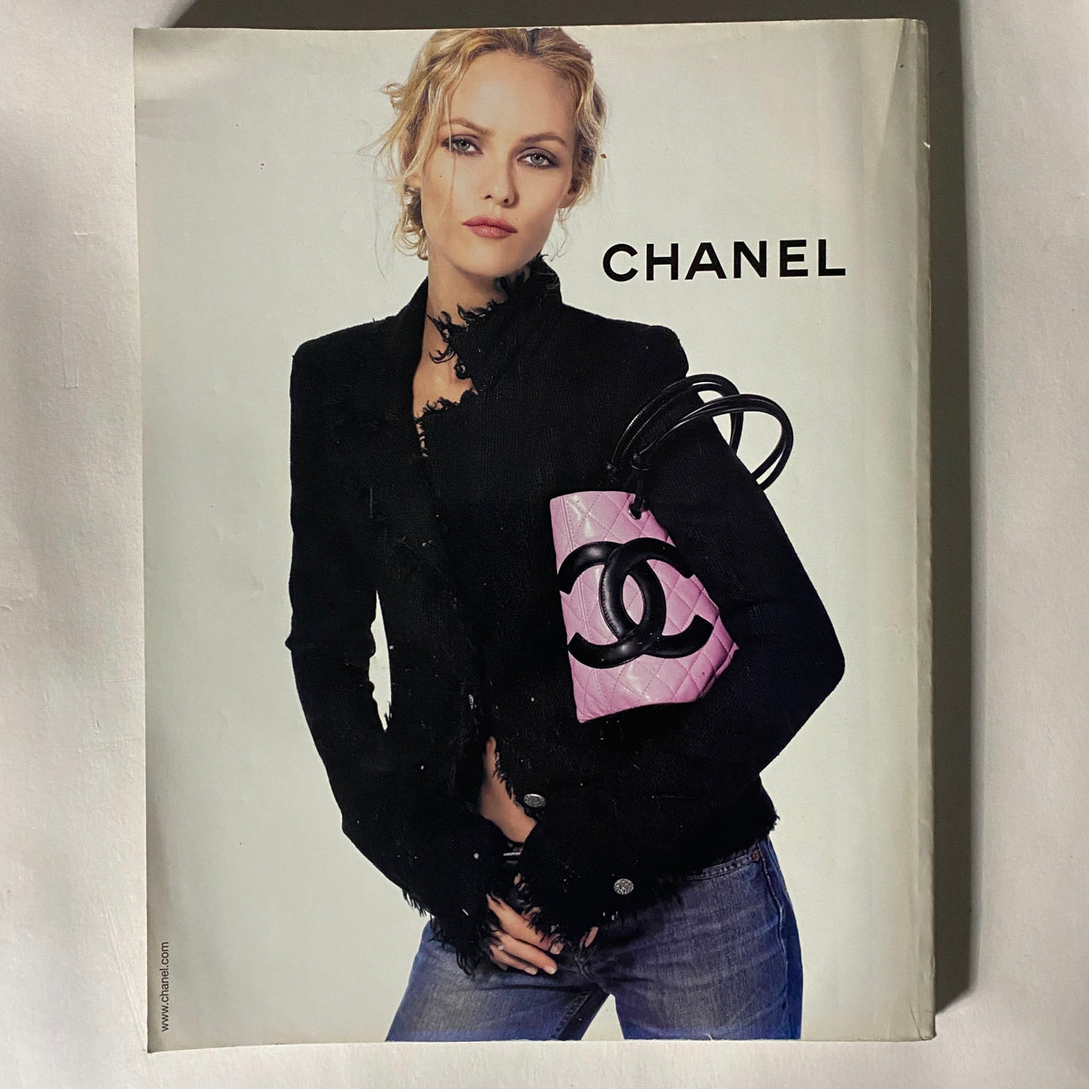 Fashion model wearing a black jacket and holding a pink Chanel handbag, featured in Vogue UK Magazine April 2004 Lily Cole, Gemma Ward Cover No Label VG.
