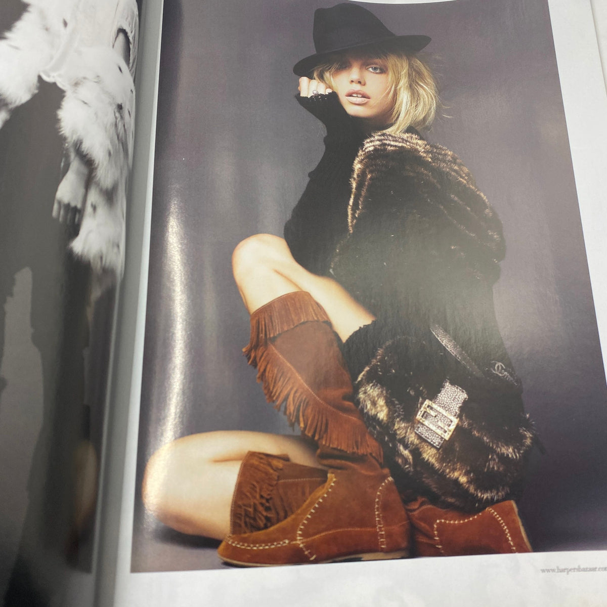 Fashion editorial from Harper's Bazaar Australia Magazine June - July 2009 featuring a model in chic attire with fringe boots and a stylish hat, reflecting late 2000s fashion trends.