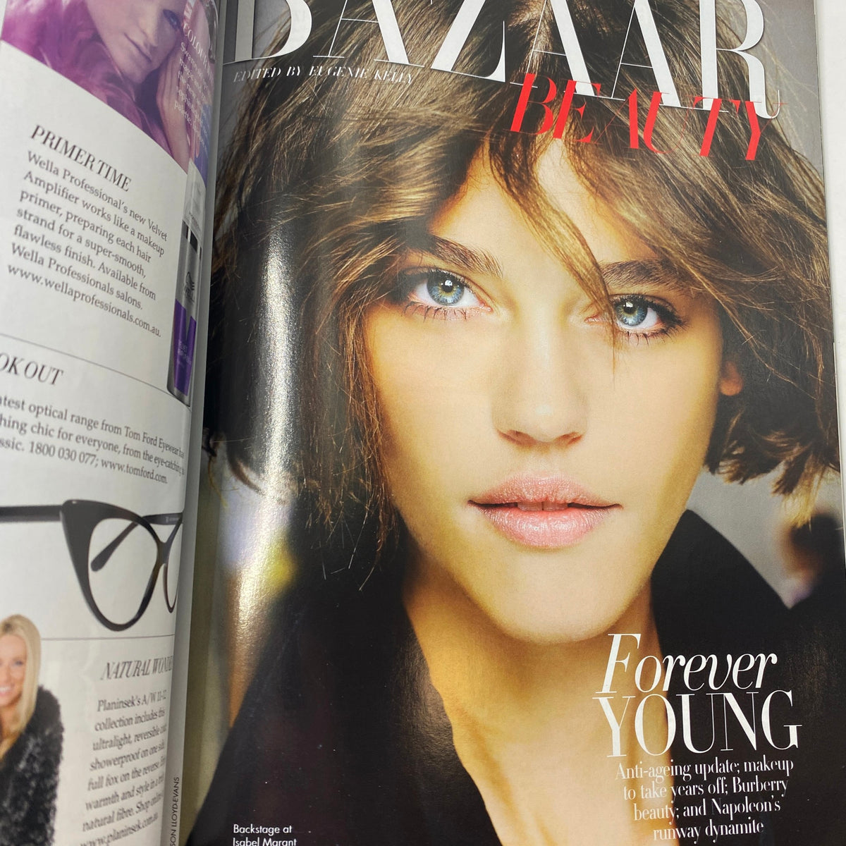 Beauty page from Harper's Bazaar Australia Magazine August 2011 featuring a captivating model with exquisite makeup, under the theme 'Forever Young'.
